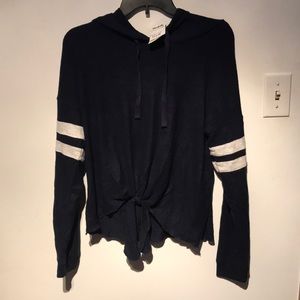 Navy hoodie with off white stripes on the arms
